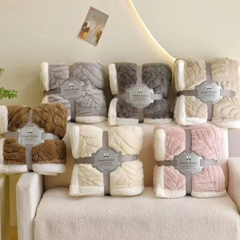 Soft plush banana leaf jacquard faux rabbit fur throw blankets in beige gray and pink with textured leaf jacquard pattern