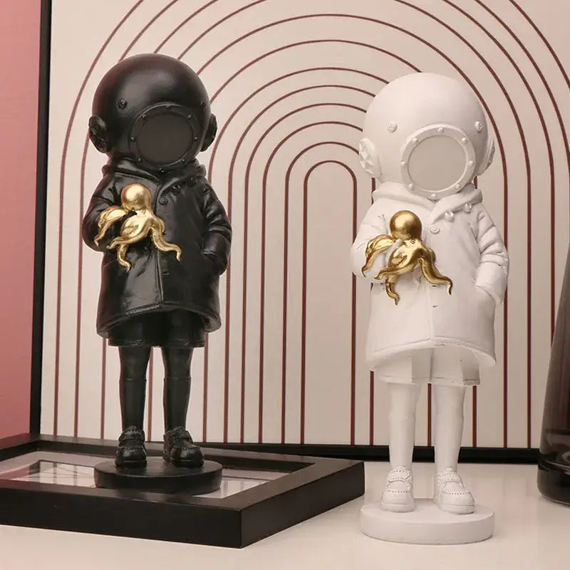Banksy deep diver black and white resin sculpture featuring astronaut figurines holding golden octopus for living room decor