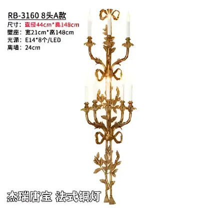 Gold-colored ornate wall sconce with intricate leaf and scrollwork design featuring eight candle-style lights baroque antique brass decorbites