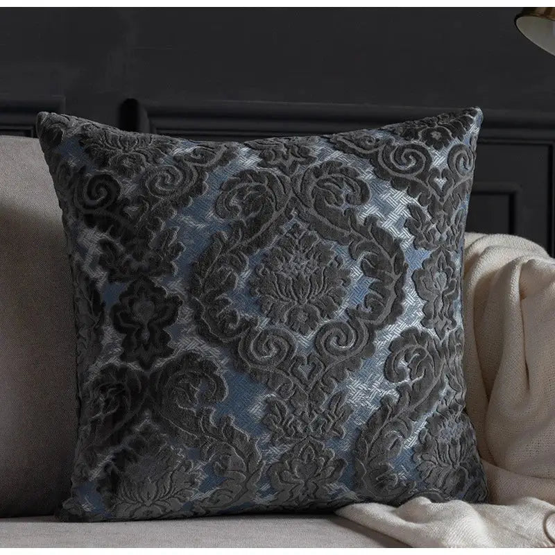 A square cushion cover with dark gray and blue damask cut velvet fabric from decorbites for living room decor