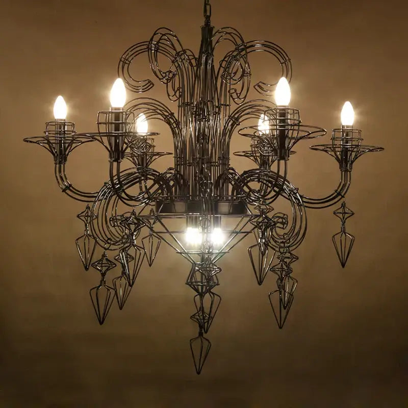 Ornate black wrought iron baroque designer led chandelier with swirling arms and geometric crystal pendants for dining room