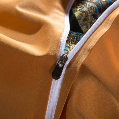 A close-up of decorbites golden jacquard bedding set zipper revealing ornate golden jacquard baroque lining