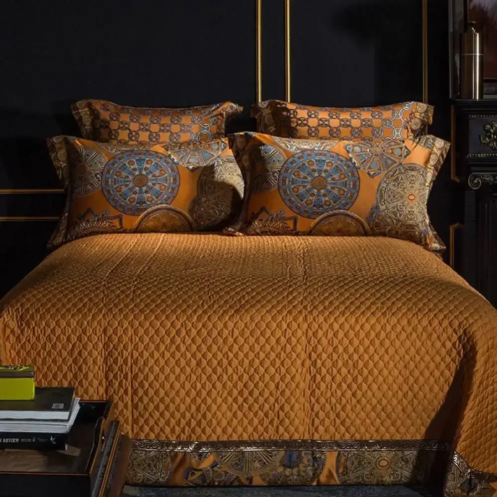 Golden quilted bedding set with intricate diamond stitching and decorbites golden jacquard baroque pillowcases in blue and gold