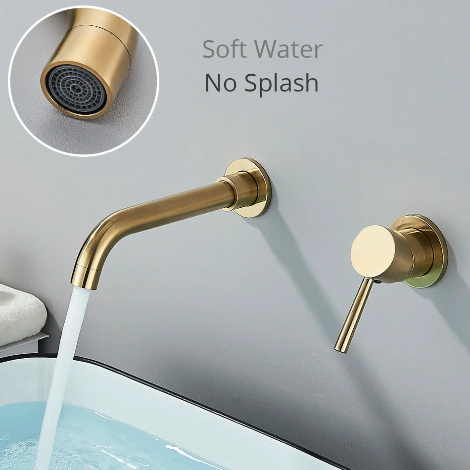 Gold-toned basin faucet wall mounted bathroom fixture with brushed brass finish and sleek hot water control handle