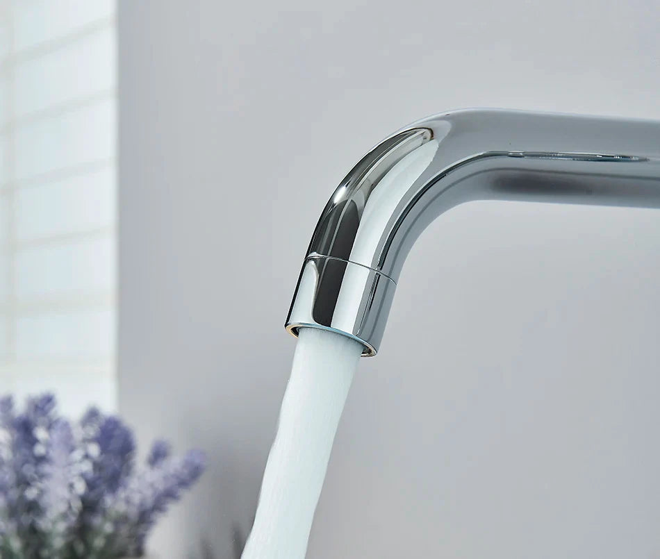 Chrome-finished basin faucet wall mounted bathroom with sleek curved spout dispensing clear water and hot water control