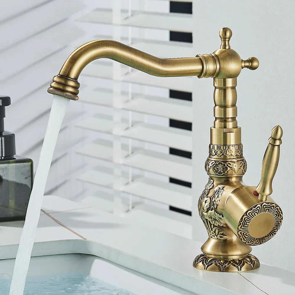 Antique brass single handle basin faucet with ornate floral and geometric engravings for single hole installation