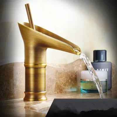Golden bamboo-style bathroom faucet with brushed antique brass finish deck mounted featuring metered valve control