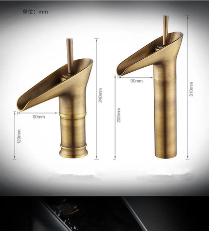 Antique brass bathroom faucet with waterfall spout deck mounted featuring sleek cylindrical base and metered valve control