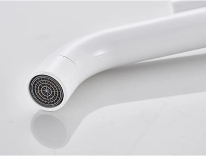 White curved bathroom faucet with sleek modern design and gray circular spray head in brushed gold mixer tap style