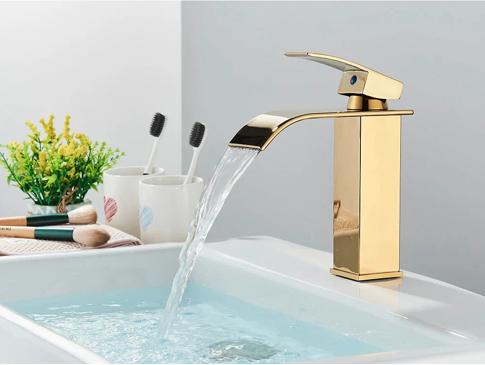 Gold-toned bathroom sink faucet brass deck mount with sleek modern design and polished stainless steel finish