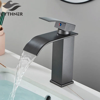 Matte black brass bathroom sink faucet with stainless steel waterfall spout and blue-red temperature indicator handle
