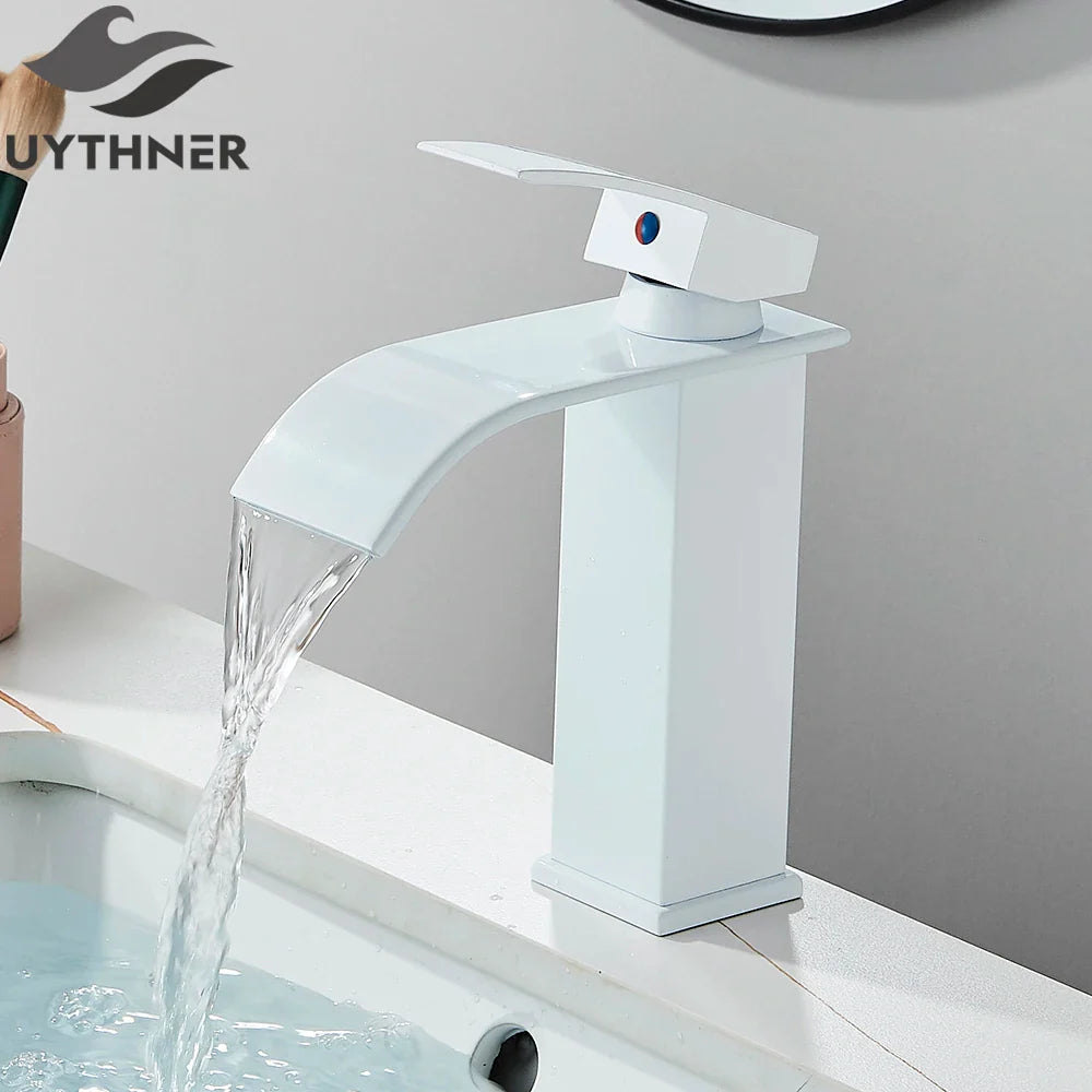 White waterfall-style bathroom sink faucet in brass deck mount with stainless steel glossy finish and modern design