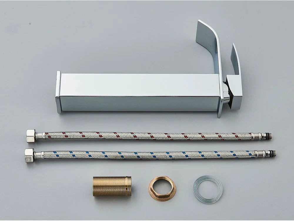 Modern chrome finished bathroom sink faucet brass deck mount with sleek minimalist design and stainless steel handle