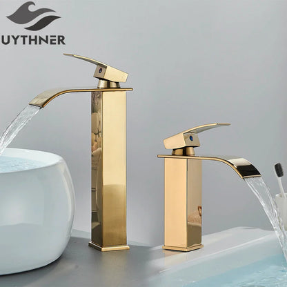 Gold-colored modern bathroom sink faucet with sleek rectangular design and stainless steel brass deck mount finish