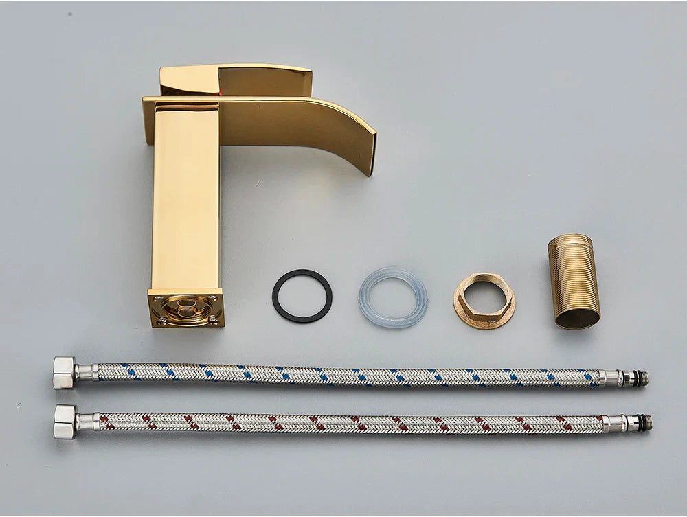 Gold-finished modern single-handle bathroom sink faucet brass deck mount with a sleek stainless steel rectangular spout