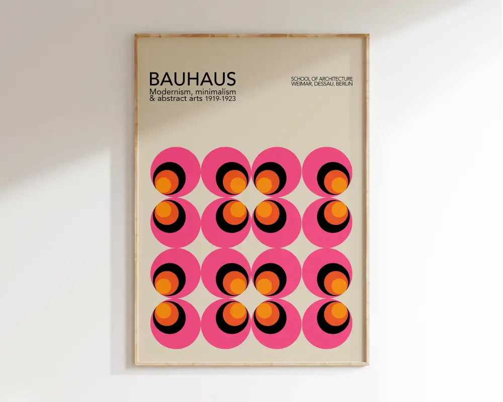A framed decorbites™ bauhaus geometric canvas art print with vibrant pink circles and concentric orange rings for home decor