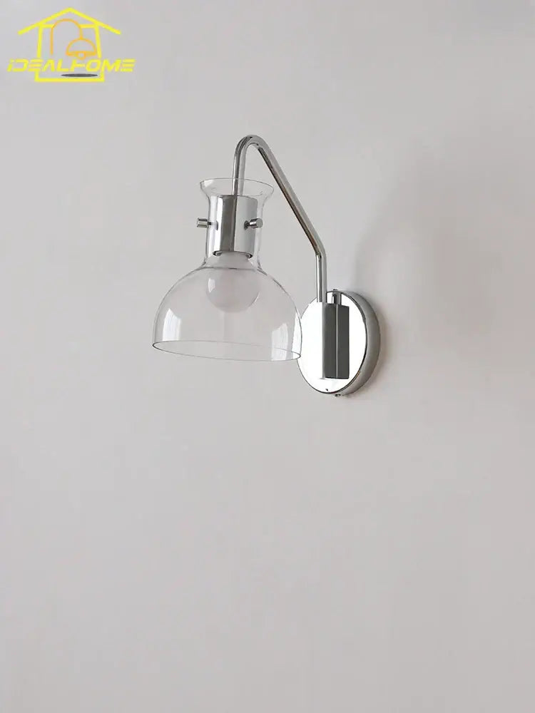 Chrome-finished bauhaus glass led wall lamp with clear glass dome shade and adjustable curved arm black metal sconce
