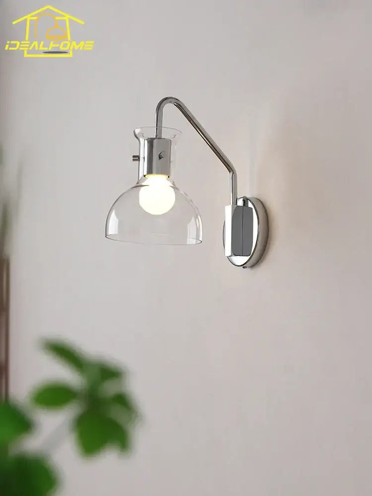 Chrome finished bauhaus glass led wall lamp with adjustable black metal sconce and clear glass dome shade for bedroom