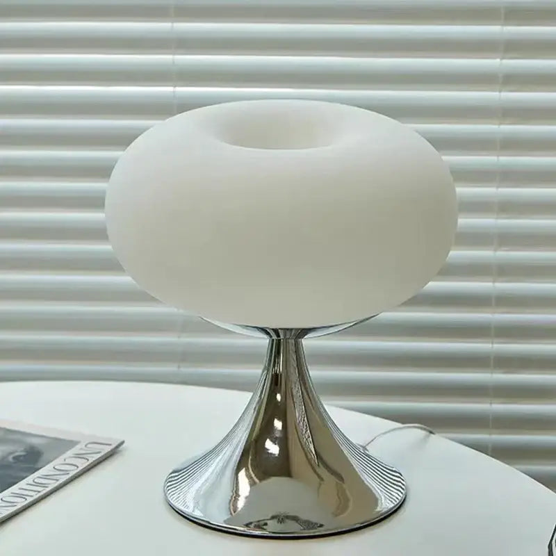 A sleek bauhaus green glass table lamp with frosted white glass dome and chrome base for living room decorbites glass table