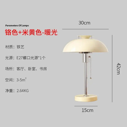 Cream-colored dome-shaped bauhaus led table lamp with sleek chrome stem and base ideal for bedroom use