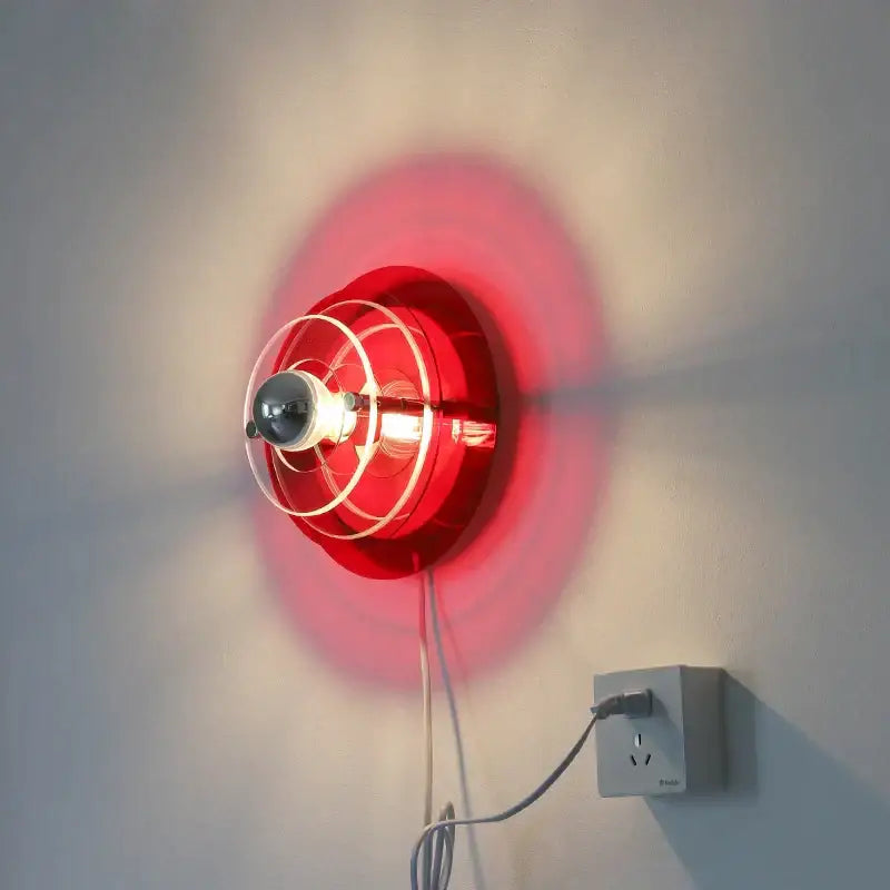 Red circular bauhaus led wall light with clear protective cage for living room sconce lighting