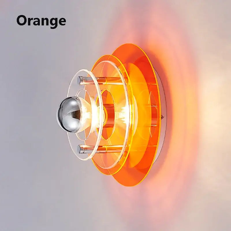 Orange translucent acrylic bauhaus led wall sconce with concentric rings and chrome bulb holder for living room