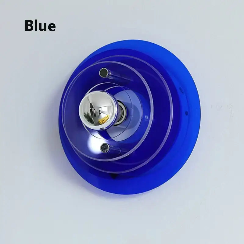 Vibrant blue bauhaus led wall light with concentric acrylic rings and chrome bulb for modern living room decor