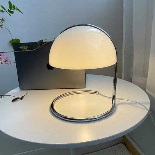 A bauhaus mushroom modern desk lamp with white opal glass dome and polished chrome frame for fireless aromatherapy use