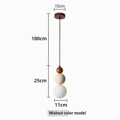 Bauhaus travertine stone and wood pendant light with three matte spherical shades in walnut off-white and white works beautifully