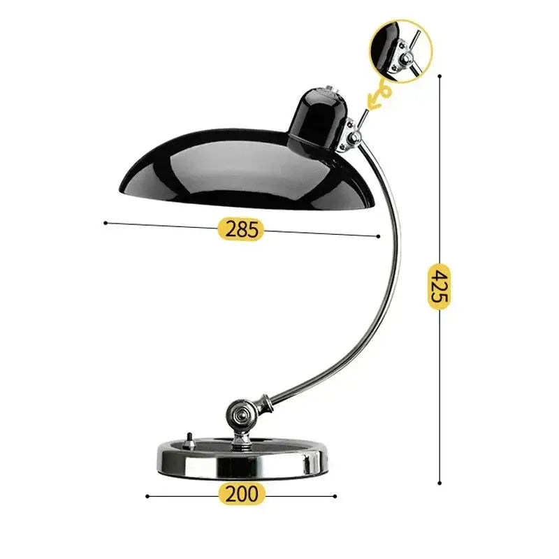 Black glossy metal bauhaus vintage desk lamp with curved chrome arm and circular base for office or bedroom use