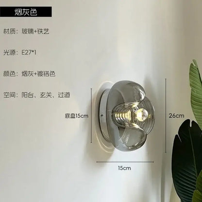 A sleek smoke-gray bauhaus wavy glass wall lamp with chrome finish for modern bedroom lighting