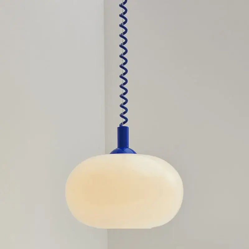 Bauhaus glass pendant light with an off-white oval glass shade and vibrant blue spiral metal chain for dining room use