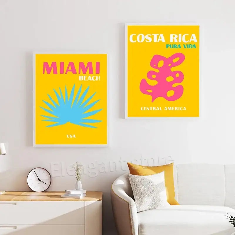 Two framed decorbites™ beach travel posters with bold yellow backgrounds featuring miami beach and costa rica designs for living room wall decor