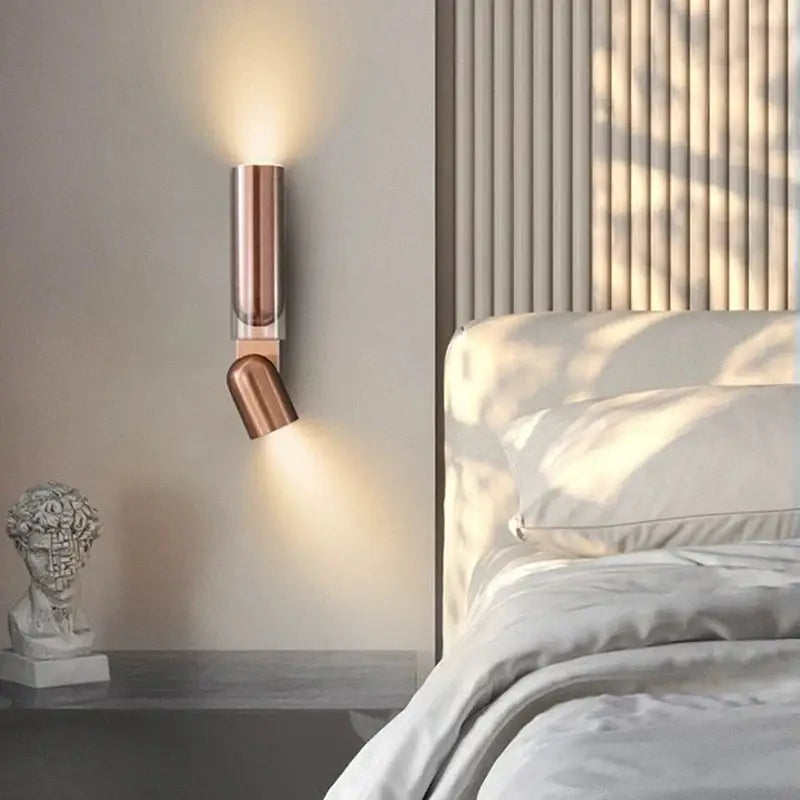 Copper-finished cylindrical bedroom wall reading lamp with sleek modern design and adjustable wall reading feature