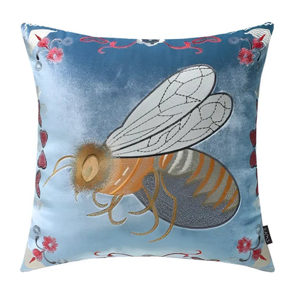 Blue velvet cushion cover with bee embroidery and pink floral accents for yellow green and blue living room decor