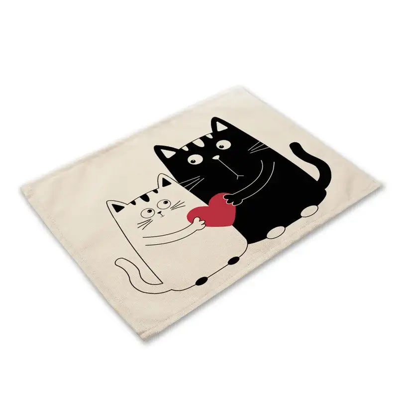Beige canvas cat linen placemat featuring black cat linen and white cat holding a red heart for dining decorbites decor
