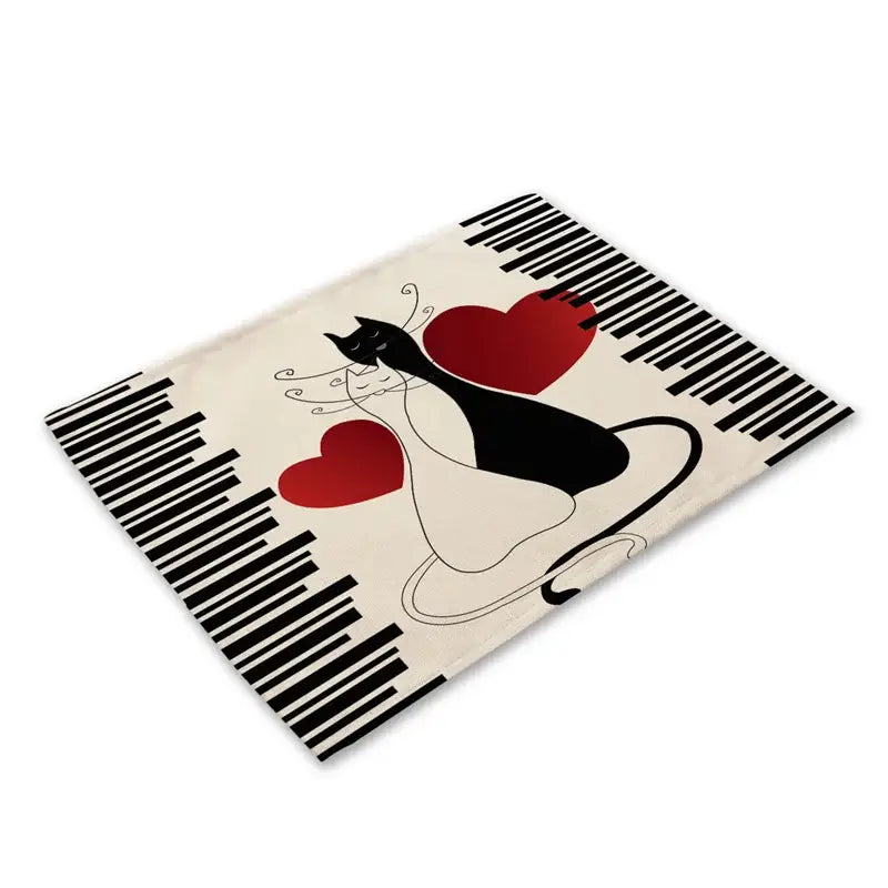 Cream-colored rectangular cat linen placemat with black and white stylized cat, red hearts, and black barcode decorbites black cat design