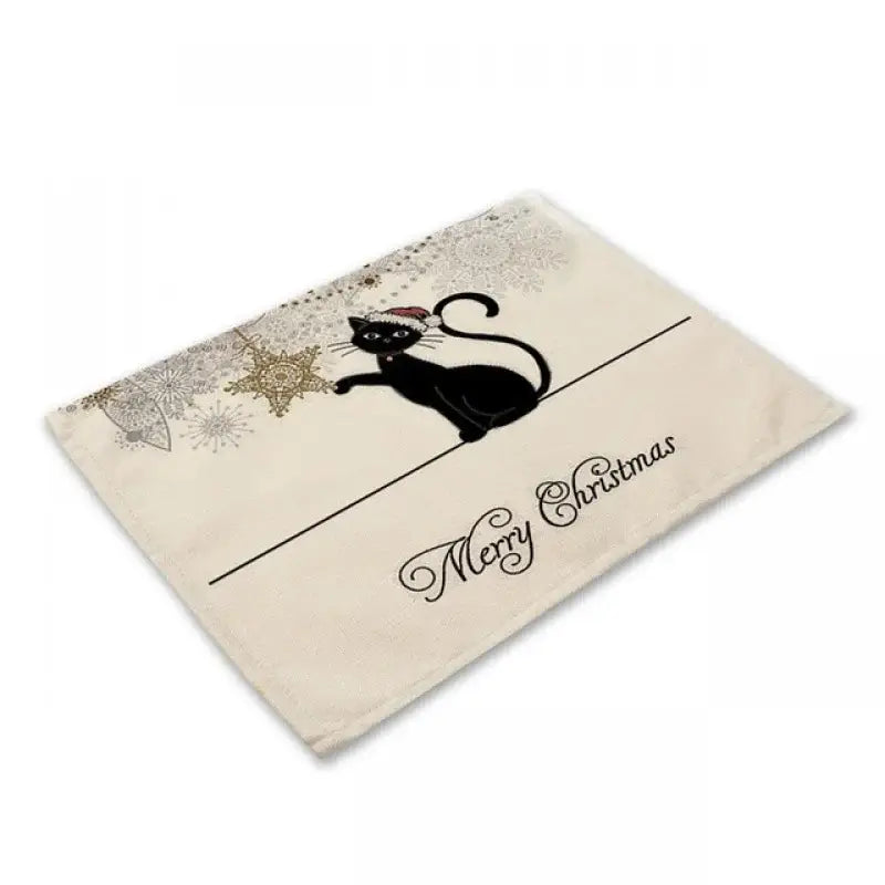Beige black cat linen placemat featuring a black cat with santa hat and gold snowflakes for dining room decorbites decor