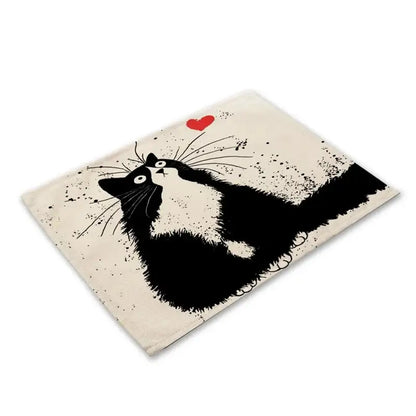 Cream-colored canvas pouch with a black and white illustrated cat and red heart, complementing decorbites black cat linen placemat set