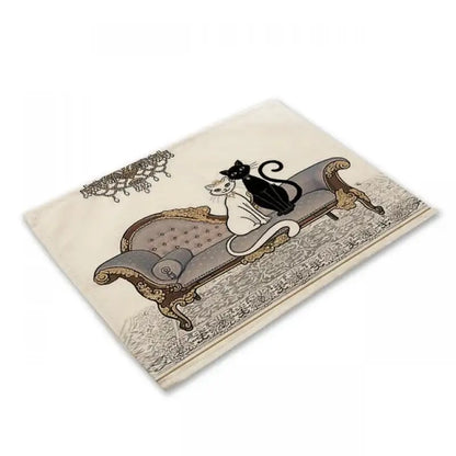 Beige rectangular cat linen placemat featuring a vintage black cat illustration on an ornate chaise lounge for dining room decorbites black cat set