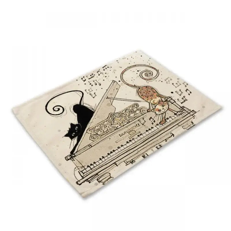Beige black cat linen placemat featuring whimsical illustration of black and orange cats with grand piano decorbites black cat