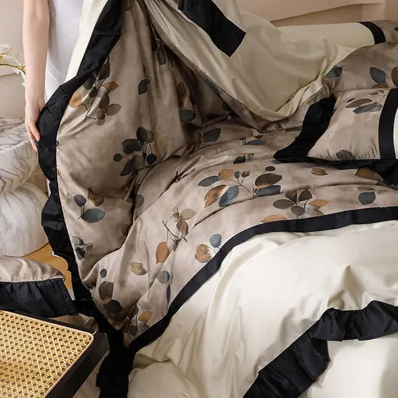 Beige and black leaf-patterned bedding set with ruffled edges made of decorbites ice rayon for ice rayon summer use
