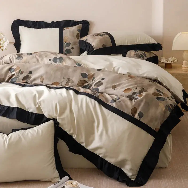 Cream-colored duvet cover with subtle leaf pattern and black ruffled trim in beige and black decorbites ice rayon summer bedding set
