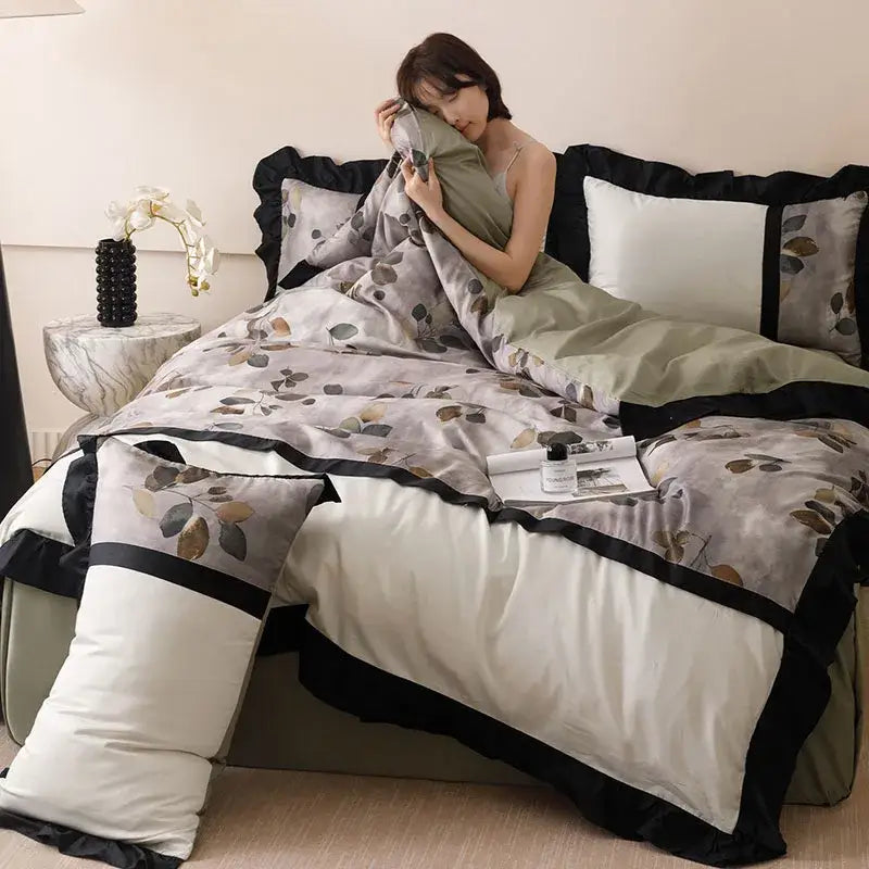 Elegant sage green and black ruffled duvet bedding set with subtle leaf pattern made from decorbites ice rayon summer material