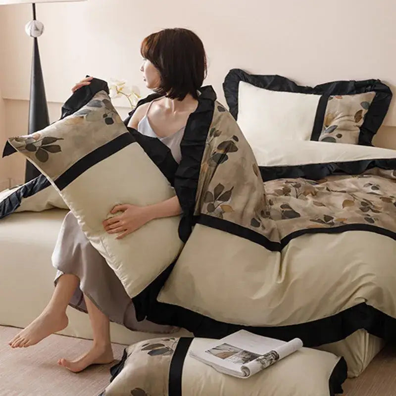 Beige and black floral bedding set with ruffled edges made of decorbites ice rayon for ice rayon summer use
