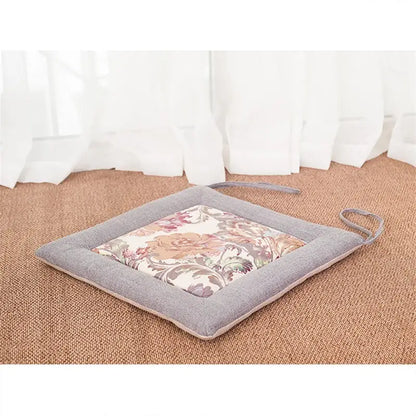 Beige and brown non-slip decorbites linen seat cushion with gray border and pastel embroidered floral pattern for dining chair