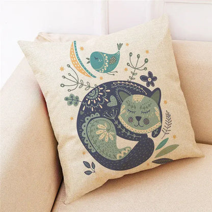 Beige cartoon cat linen throw pillow with whimsical sleeping green cat, teal bird, and stylized foliage decorbites cartoon cat design