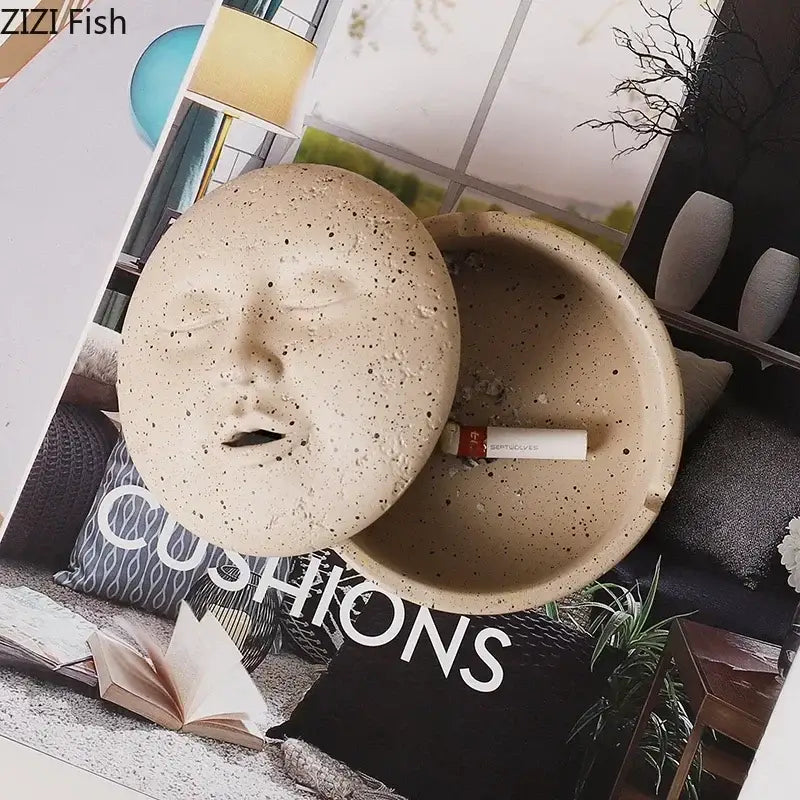 Beige ceramic ashtray with lid featuring a sculpted human face character for decorbites human face office decor
