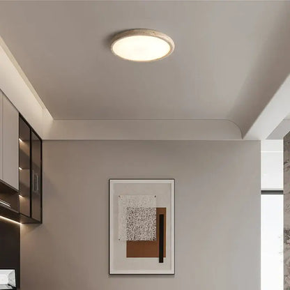 Beige concrete brass led flush mount ceiling lamp with circular recessed matte textured finish and soft diffused light