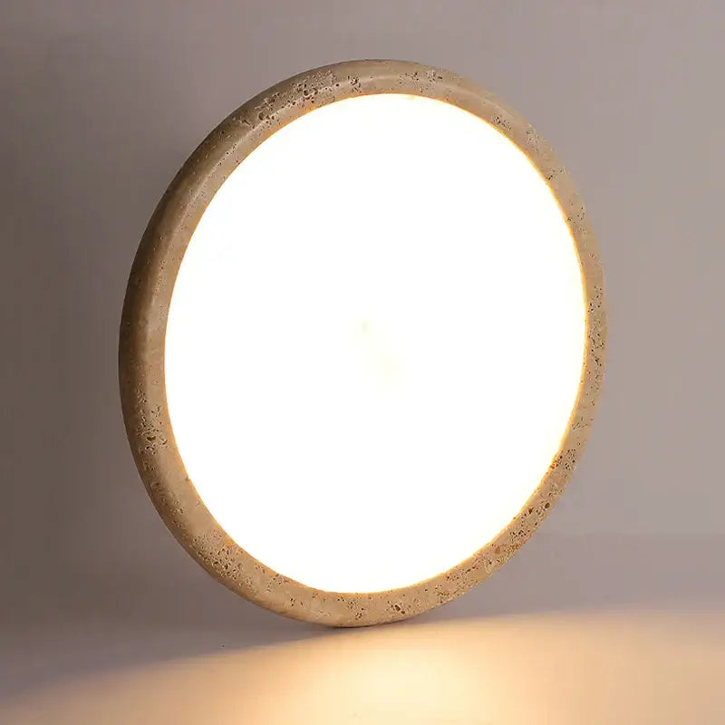 Beige concrete brass led flush mount light ceiling lamp with circular recessed design and bright white illuminated center